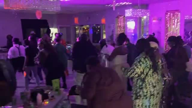 Guests enjoying an indoor celebration. Silent event preview.